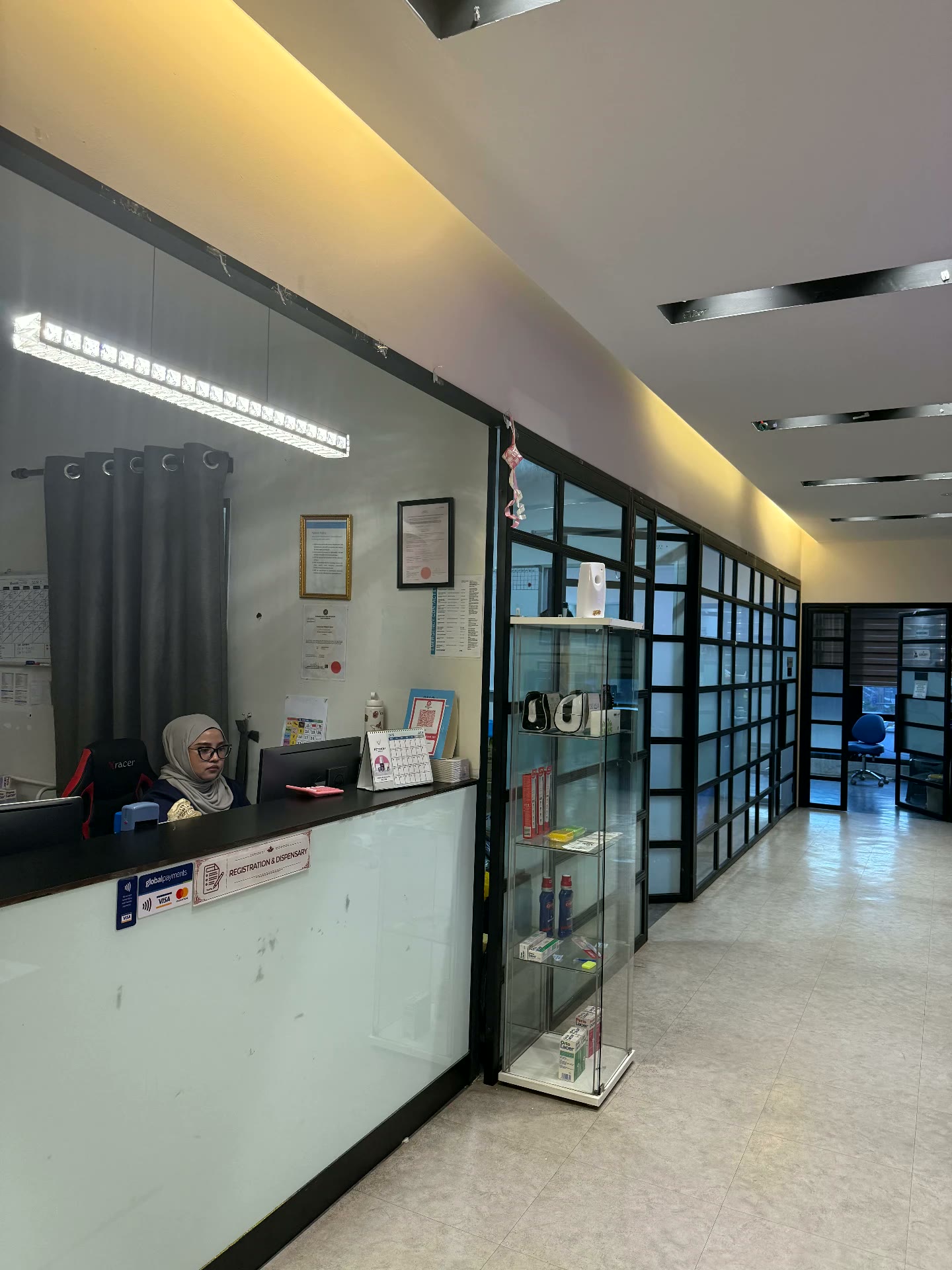 A dental clinic front desk and dispensary
