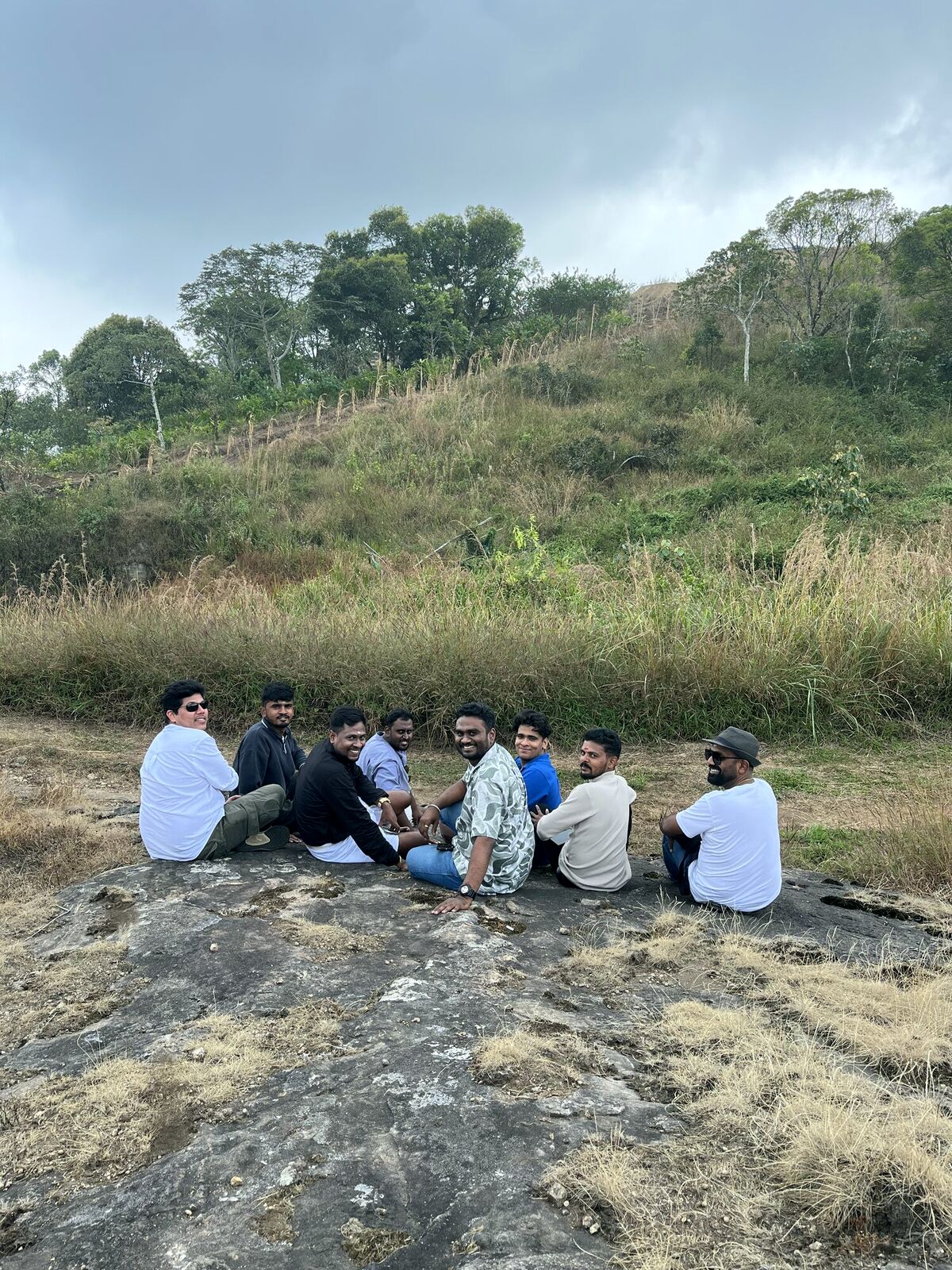 Tribe back pose on a rock